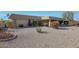 House exterior with a gravel front yard and well-maintained landscaping at 9346 W Glen Oaks N Cir, Sun City, AZ 85351