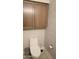 Clean bathroom with toilet and wood cabinets at 9750 E Radioactive Dr, Mesa, AZ 85212