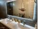 Modern bathroom with double vanity, LED mirror, and stylish fixtures at 9750 E Radioactive Dr, Mesa, AZ 85212