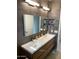 Double vanity with modern wood cabinets and sleek sinks at 9750 E Radioactive Dr, Mesa, AZ 85212