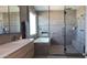 Spa-like bathroom with walk-in shower and soaking tub at 9750 E Radioactive Dr, Mesa, AZ 85212