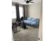 Bright bedroom with a daybed and exercise equipment at 9750 E Radioactive Dr, Mesa, AZ 85212