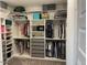 Large walk-in closet with ample shelving and hanging space at 9750 E Radioactive Dr, Mesa, AZ 85212