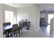 Dining room with kitchen view and staircase at 9750 E Radioactive Dr, Mesa, AZ 85212