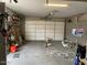 Garage with built-in cabinets and overhead storage at 9750 E Radioactive Dr, Mesa, AZ 85212