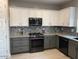 Modern kitchen with granite countertops and stainless steel appliances at 9750 E Radioactive Dr, Mesa, AZ 85212