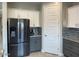 Kitchen with stainless steel appliances and gray cabinets at 9750 E Radioactive Dr, Mesa, AZ 85212