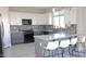 Gray and white kitchen with granite countertops and island at 9750 E Radioactive Dr, Mesa, AZ 85212