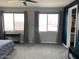 Main bedroom with ample space, large windows, and access to walk-in closet at 9750 E Radioactive Dr, Mesa, AZ 85212