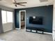 Main bedroom with a view, large TV, and ensuite bathroom access at 9750 E Radioactive Dr, Mesa, AZ 85212