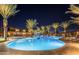 Night view of a resort-style pool with palm trees at 9750 E Radioactive Dr, Mesa, AZ 85212