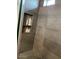 Modern shower with built-in shelves and gray tile at 9750 E Radioactive Dr, Mesa, AZ 85212