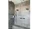 Walk-in shower with dual shower heads and built-in seat at 9750 E Radioactive Dr, Mesa, AZ 85212