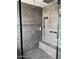 Modern shower with multiple shower heads and geometric tile at 9750 E Radioactive Dr, Mesa, AZ 85212