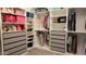 Large walk-in closet with ample shelving and drawers at 9750 E Radioactive Dr, Mesa, AZ 85212