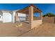 Covered patio with pergola and steps, adjacent to a partially-finished backyard at 9821 E University Dr, Mesa, AZ 85207