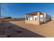 Backyard view of the house with a pergola at 9821 E University Dr, Mesa, AZ 85207