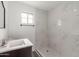 Clean bathroom, featuring a walk-in shower and modern vanity at 9821 E University Dr, Mesa, AZ 85207