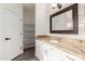 Bathroom boasts granite vanity and tiled shower/tub combo at 9821 E University Dr, Mesa, AZ 85207