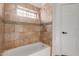 Clean bathroom with tiled shower and neutral color scheme at 9821 E University Dr, Mesa, AZ 85207