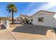 Recently updated home with a white exterior and a palm tree at 9821 E University Dr, Mesa, AZ 85207