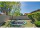 Landscaped backyard with a large trampoline at 9825 E Sharon Dr, Scottsdale, AZ 85260