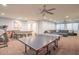 Game room with ping pong table, sectional sofa, and home gym equipment at 9825 E Sharon Dr, Scottsdale, AZ 85260