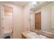 Bathroom with tub, sink, and built-in shelving at 9825 E Sharon Dr, Scottsdale, AZ 85260