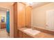 Bathroom with light wood cabinets, a large mirror and a shower at 9825 E Sharon Dr, Scottsdale, AZ 85260