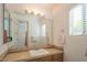 Clean bathroom with updated vanity, large mirror, and tile flooring at 9825 E Sharon Dr, Scottsdale, AZ 85260