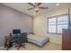 Bedroom with desk, chair, and double bed at 9825 E Sharon Dr, Scottsdale, AZ 85260