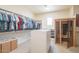 Large walk-in closet with built-in shelves and sauna at 9825 E Sharon Dr, Scottsdale, AZ 85260