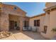 Outdoor patio area with seating and a fireplace at 9825 E Sharon Dr, Scottsdale, AZ 85260