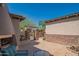 Stone-accented courtyard with seating area and gated entrance at 9825 E Sharon Dr, Scottsdale, AZ 85260