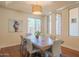 Bright dining room with large windows and hardwood floors at 9825 E Sharon Dr, Scottsdale, AZ 85260