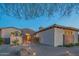 Spanish-style home with stone accents and a welcoming entryway at 9825 E Sharon Dr, Scottsdale, AZ 85260