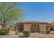 Single-story home with stone accents and a terracotta roof at 9825 E Sharon Dr, Scottsdale, AZ 85260