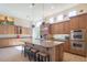 Spacious kitchen with an island, stainless steel appliances, and custom cabinetry at 9825 E Sharon Dr, Scottsdale, AZ 85260