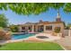 Inviting pool and spa with a rock waterfall feature at 9825 E Sharon Dr, Scottsdale, AZ 85260