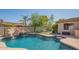 Relaxing pool with a waterslide and a covered patio area at 9825 E Sharon Dr, Scottsdale, AZ 85260