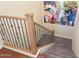 Wooden staircase with metal balusters leading to the upper level at 9825 E Sharon Dr, Scottsdale, AZ 85260