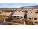 Aerial view showcasing the home's backyard, landscaping, and mountain views at 9945 E Prospector Dr, Gold Canyon, AZ 85118