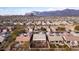 Aerial view of house and surrounding neighborhood with mountain backdrop at 9945 E Prospector Dr, Gold Canyon, AZ 85118