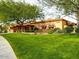 Landscaped community center with a large green lawn at 9945 E Prospector Dr, Gold Canyon, AZ 85118