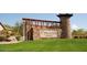 Stone entrance to Peralta Trails community with a water feature at 9945 E Prospector Dr, Gold Canyon, AZ 85118