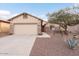 Charming one-story home with a two-car garage and landscaped front yard at 9945 E Prospector Dr, Gold Canyon, AZ 85118