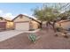 Charming one-story home with a two-car garage and landscaped front yard at 9945 E Prospector Dr, Gold Canyon, AZ 85118