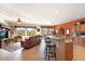 Open living area features a brown leather sofa and a view into the kitchen at 9945 E Prospector Dr, Gold Canyon, AZ 85118