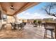 Relaxing covered patio with outdoor furniture and a fire pit at 9945 E Prospector Dr, Gold Canyon, AZ 85118