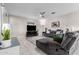 Spacious living room with gray sectional sofa and large TV at 10614 E Twister Ave, Mesa, AZ 85212